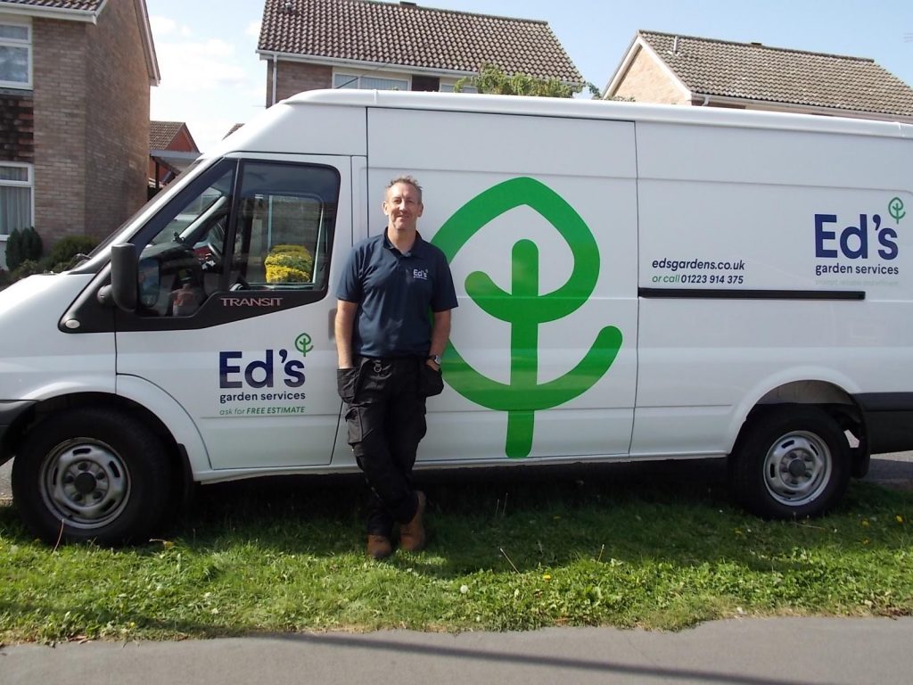 Ali's in front of his Ed's gardening van
